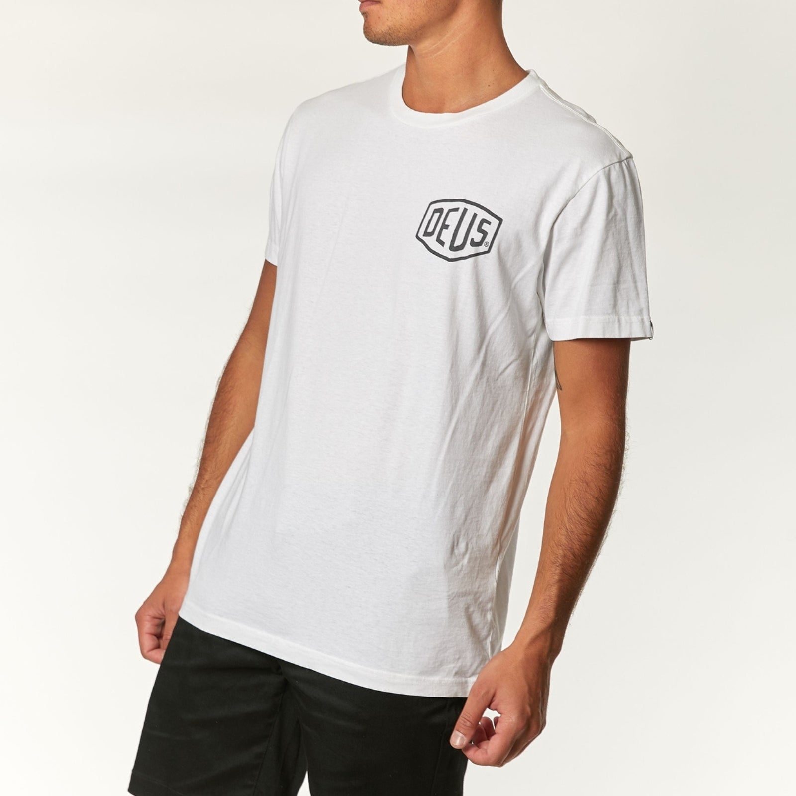 Classic white Deus Ex Machina t-shirt featuring the brand's iconic logo and bold design.
