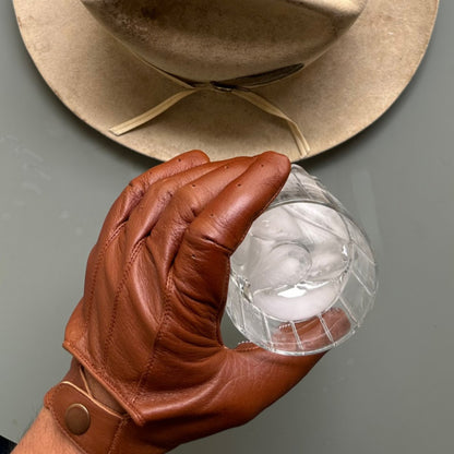 Vintage motorcycle gloves made from premium lambskin leather, designed for comfort and durability.