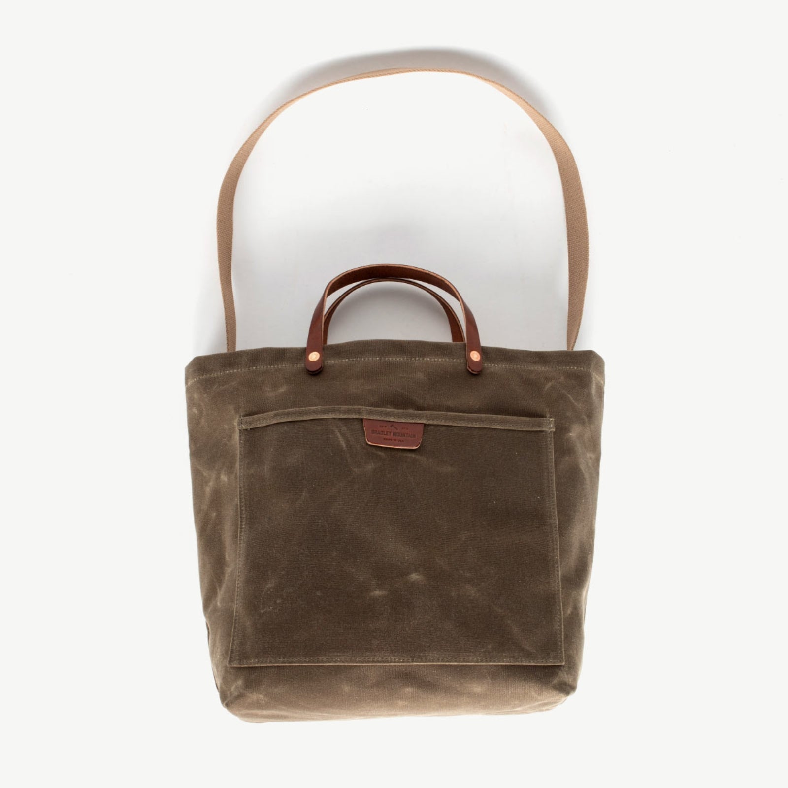 Sturdy waxed duck canvas tote bag with a rugged, featuring comfortable handles and a spacious interior for everyday use.